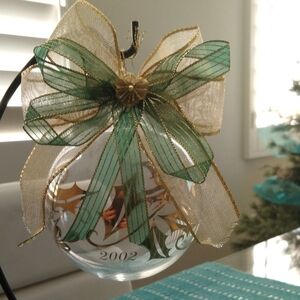 Elegant Vintage Holiday Ornament with Green and Gold Bow